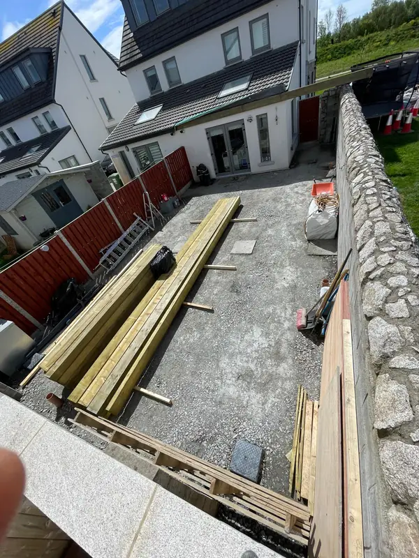 Rear extension in progress with structural timber laid out on the prepared site